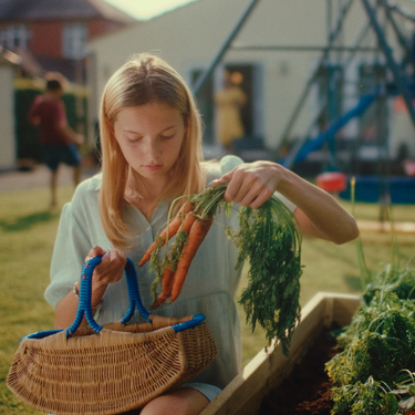 Girl harvesting vegetables